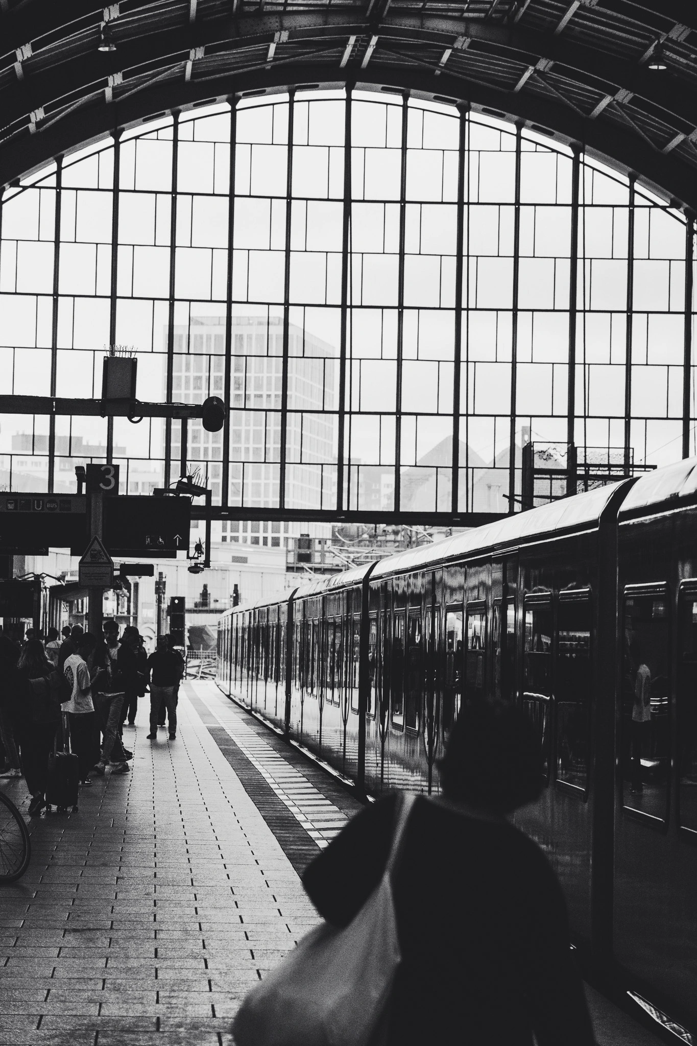 Rosa-Luxemburg-Platz platform with warm light and a train to Pankow
