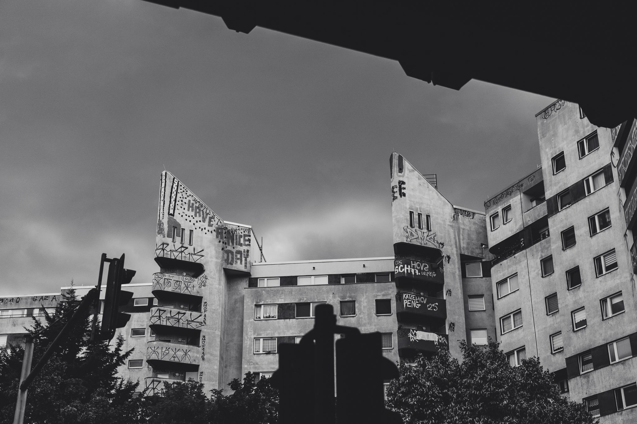 Wings of the Zentrum Kreuzberg towers under a dark sky, black and white