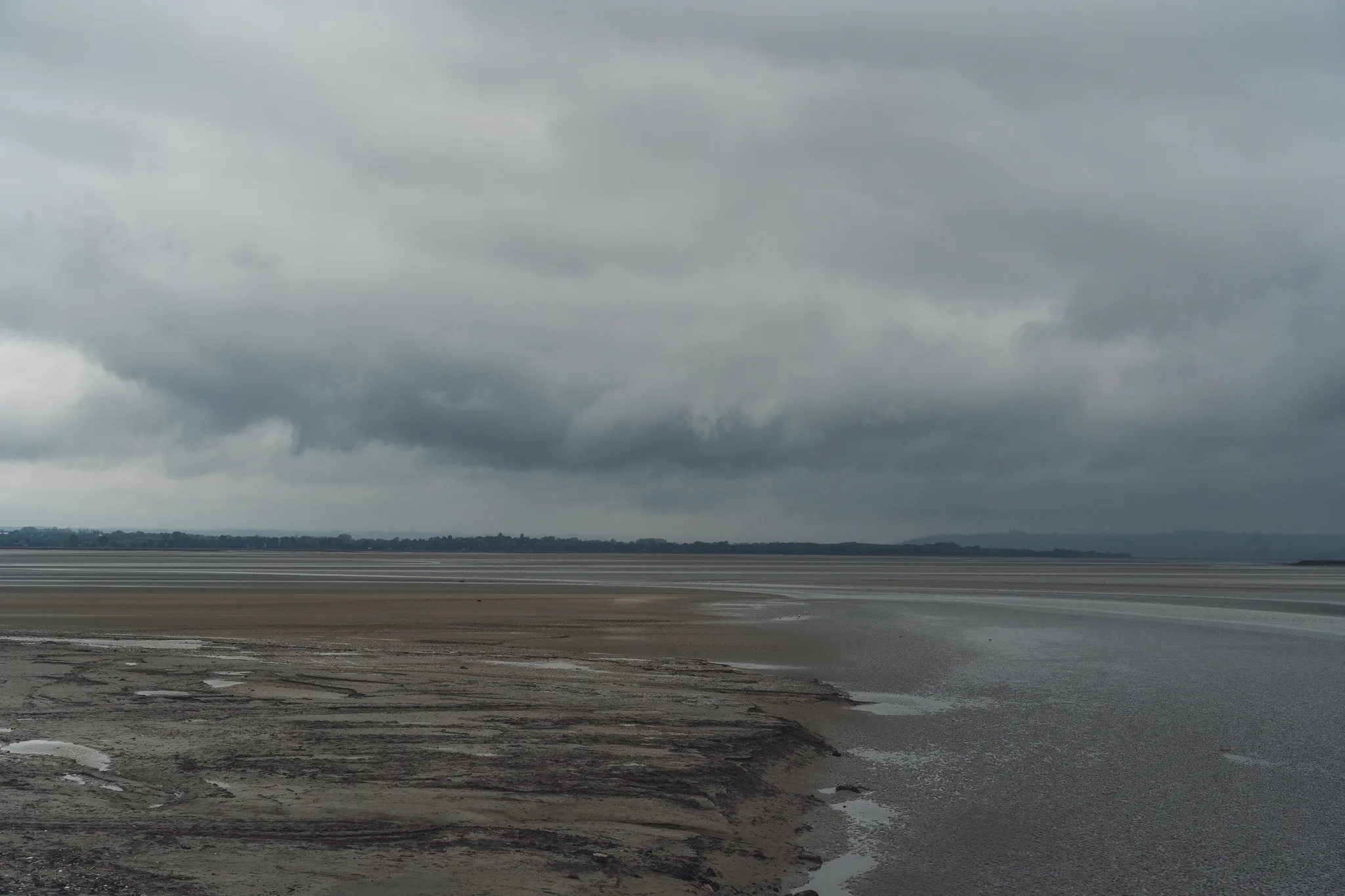 Mudflats of the bay of Mont-Saint-Michel under heavy cloud